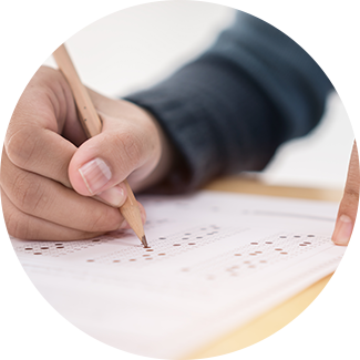 Student filling in boxes during a test